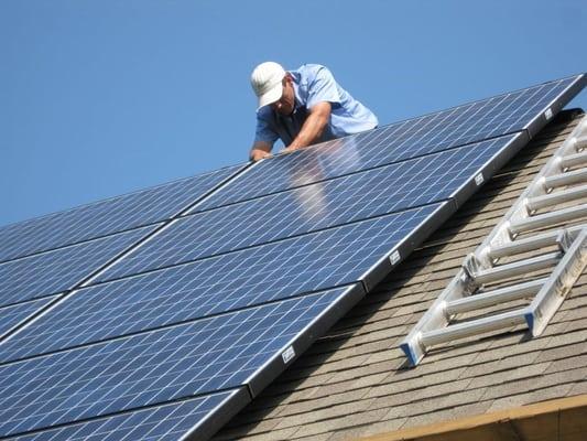 Rich Doucette, managing partner at Freedom Renewable Energy, hard at work on a solar photovoltaic installation in Hollis, NH