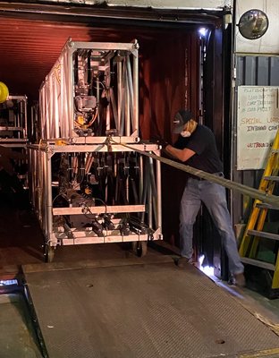 Shockwave Cargo onsite operations team loading ocean containers with Truss/Lighting/Video for Concert tours and Broadway shows.