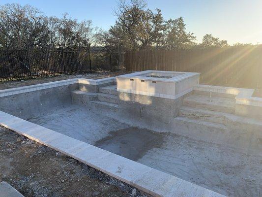 Pool build 2023-'24: waterline tile and Desert Cream Travertine coping complete