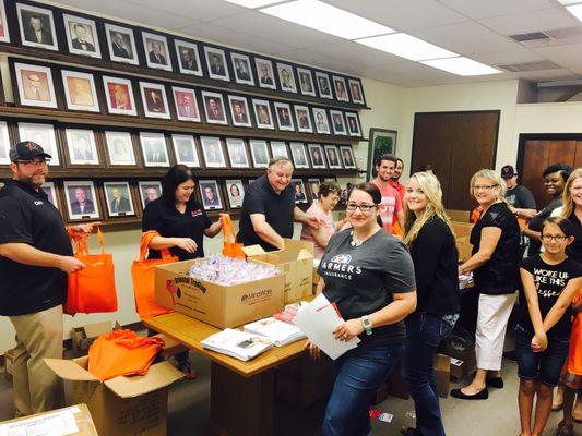 Stuffing Teacher Bags at the Chamber office..