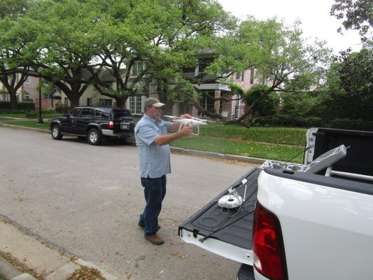 Setting up drone for roof inspection.