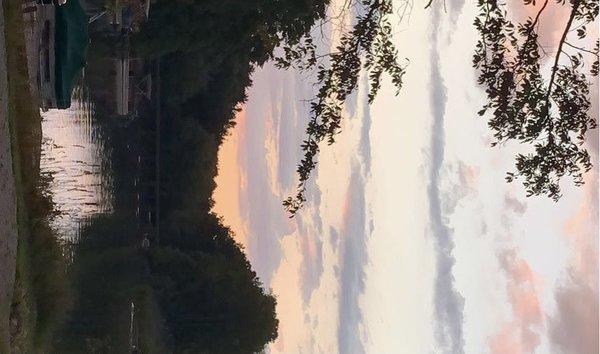 Bridge by the entrance at sundown .