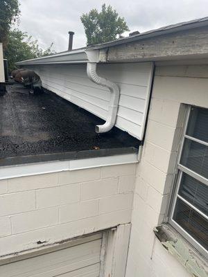 this is the gutter solution you installed to finish up the nearly 2 month job on your Invoice #121101. Where is the water supposed to go?