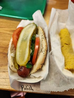 Polish sausage Chicago style and a beef tamale.