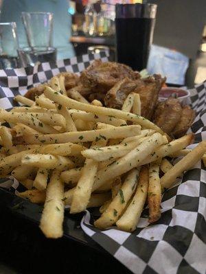 Lemon Pepper wings fried hard. Fries: crispy, salty, divine!