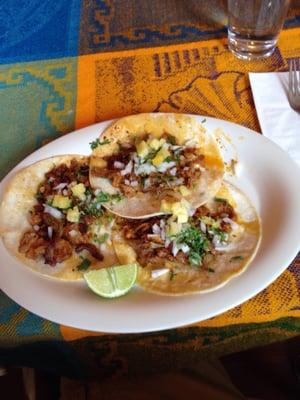 Tacos al pastor, they have pineapple topping that I like.