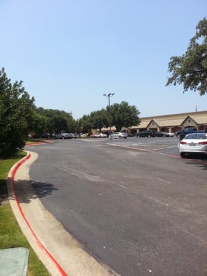 Ample parking with fully grown trees in a park like setting is a welcome amenity