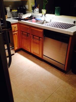 Spotless stainless steal appliances, clean grout on countertops and sparkling floor!