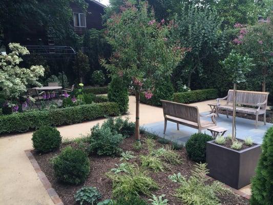 lawn removed and replaced with gracious bluestone patios and wide d.g. paths. Three distinct seating areas for entertaining.