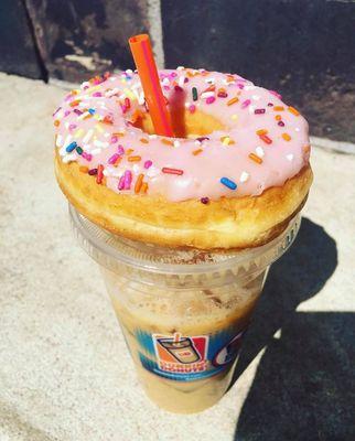 Medium iced coffee with a strawberry donut