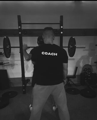 Coach Sean going over the basics of the barbell back squat ‍