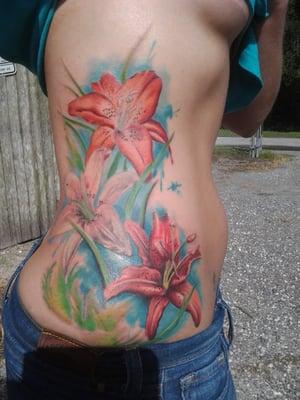 Freehand floral rib panel tattoo