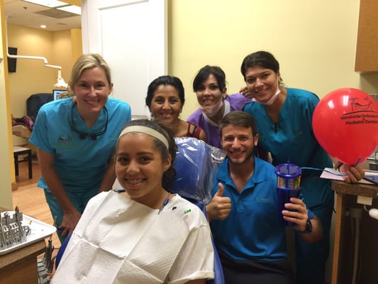 Dr Ferrer and Dr Herrero celebrating a patient getting their braces off.