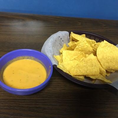 Chips and a hot yellow sauce. Delish