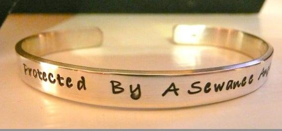 14 gauge sterling silver bracelet with hand stamped  "protected by a sewanee angel (™)".  Completely hand made by artist Jenn.