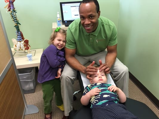 Dr.Anderson giving my little guy some sinus relief while our little miss gives him a love!