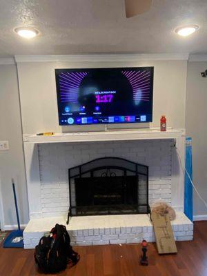 TV INSTALL OVER FIR PLACE WITH MANTLE, HODE WIRE WITH A PLASTIC STRIP.