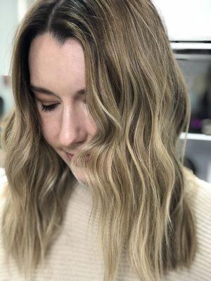 Lived in sandy blonde balayage and textured cut done by Cole