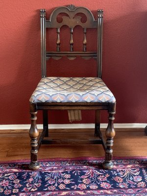 The chair is over 100 years old. This is the old fabric that had hard, crumbly, black stuffing that was reduced to powder.