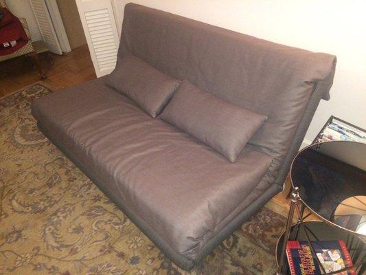 This futon cover and two pillows cost $900