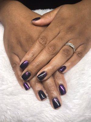 Gel manicure with chrome powder and cat eye design