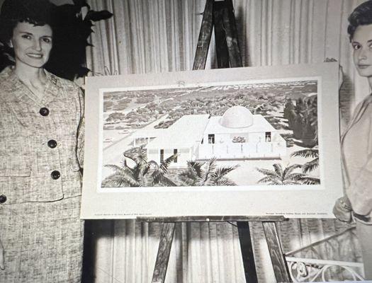 Nancy Myers on left holding a photo of the proposed 1960's expansion.