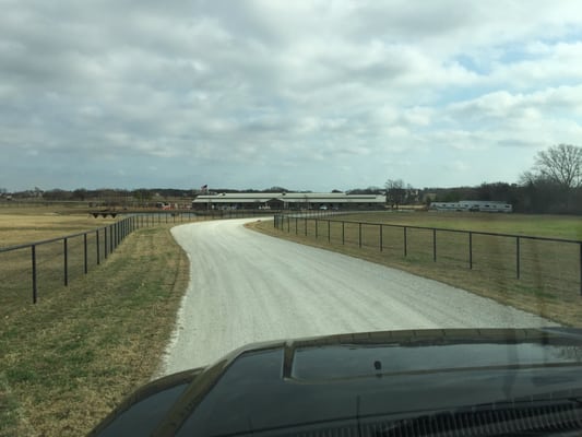 Drive up to the barn from the electric gate with great turn out for the horses.