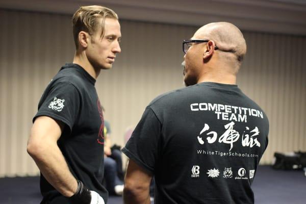 Cody "JUSTICE" Halleman discussing strategy before the fight with Coach Green