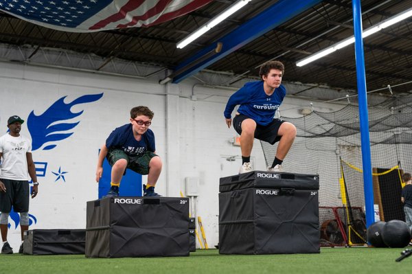 Two youth athletes in training session.