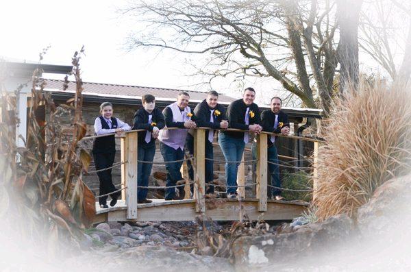 Grooms photo over bridge