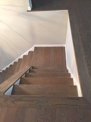 Wood stairs, stained.