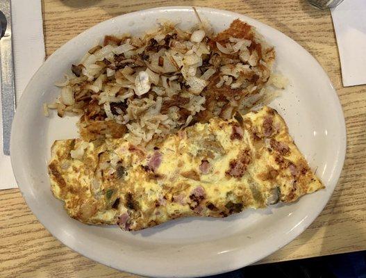 Omelette and hash browns with onions.