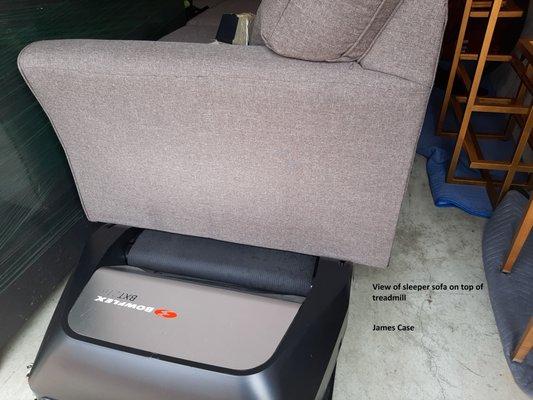 Sleeper sofa sitting on treadmill