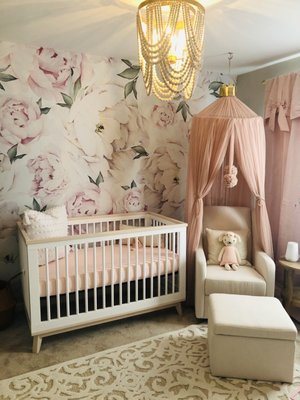 Post Lou's work in the nursery. Peel and stick wall paper, hanging of canopy, and hanging of window treatments.