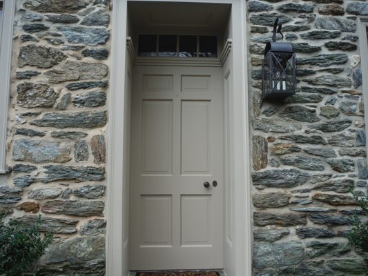 Farmhouse door and trim professionally prepared, primed, caulked and painted