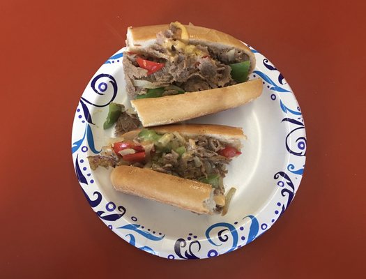 Philly cheesesteak with tricolor peppers and onions.