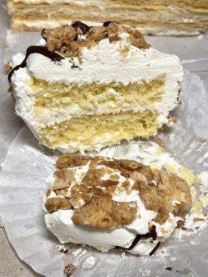 Personal cannoli cake, cannoli pieces on outside, vanilla cake and sweet ricotta frosting - shows cannoli pieces on outside