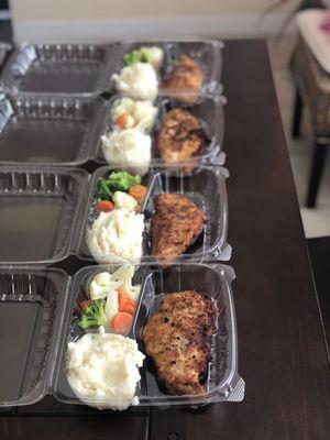 breaded chicken with mashed potatoes and vegetables