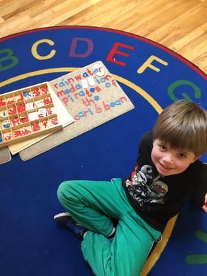 Spelling words from his reading book