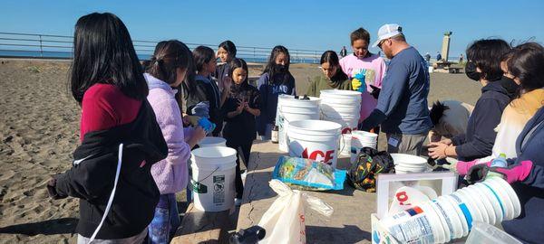 Beach cleanup! Who can fill the most buckets?