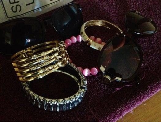 Bracelets and sunglasses. Glasses were $6 each and the bracelets were $12 and $5.