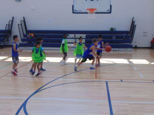 Campers playing small-sided games on lowered hoops (7ft. size).