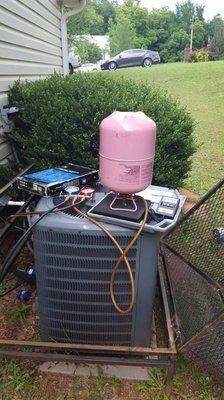 Repair gas leak, replace dryer, vacuum and recharge system.