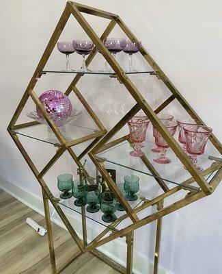 Awesome 70s diamond brass shelf with a selection of color glasswares