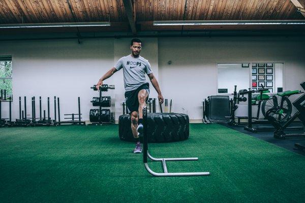 Dallas Mavericks Jalen Brunson doing hip mobility drills