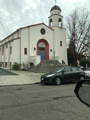 On the corner of Alma McKinley. The Trinity Lutheran church has its own parking lot.