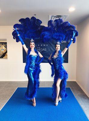 Las Vegas showgirls in blue corset style showgirl costumes.