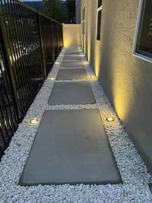 Concrete steps with lighting and rocks