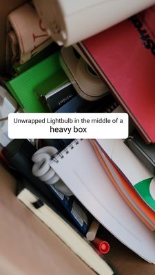 Unwrapped lightbulb under the heavy items