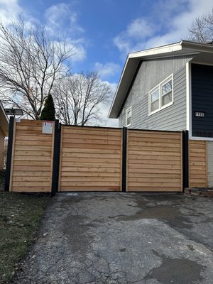 6' high cedar layered horizontal/ double gate.